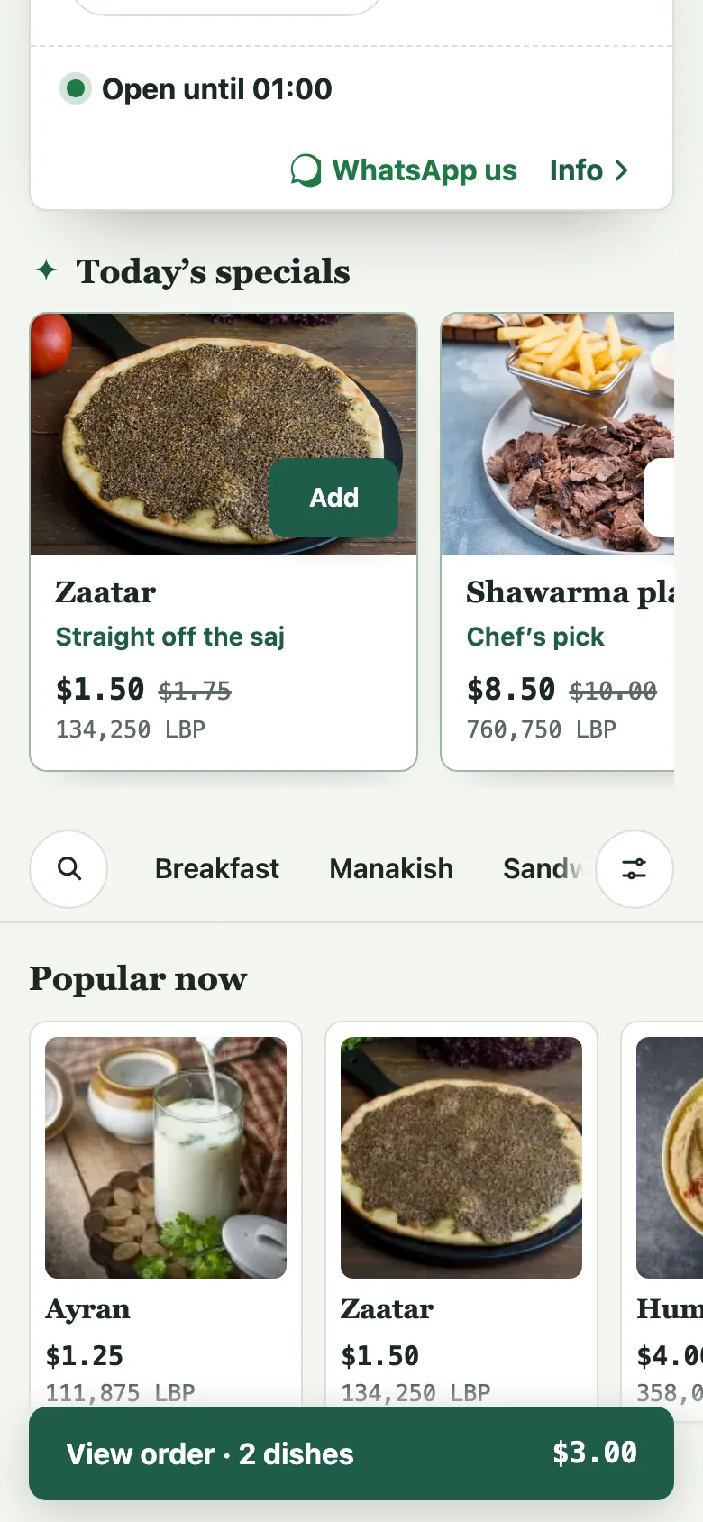 The WhatsApp us button sits at the head of the menu on a phone.